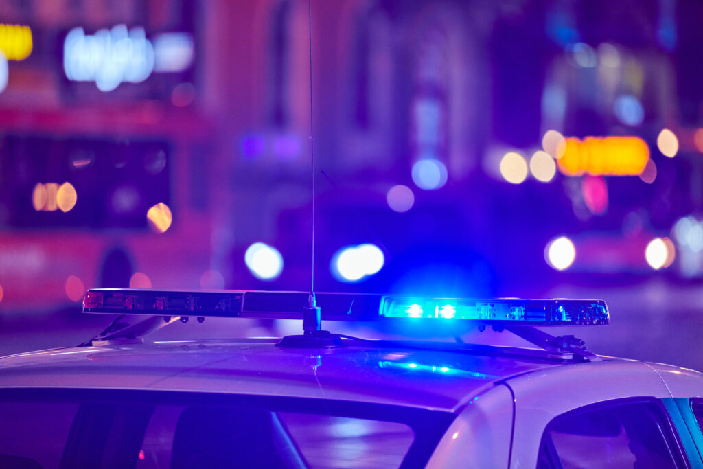 Picture of a police car with blue flashing light