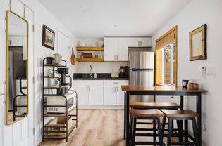 Front view of a small remodeled kitchen with shaker cabinets