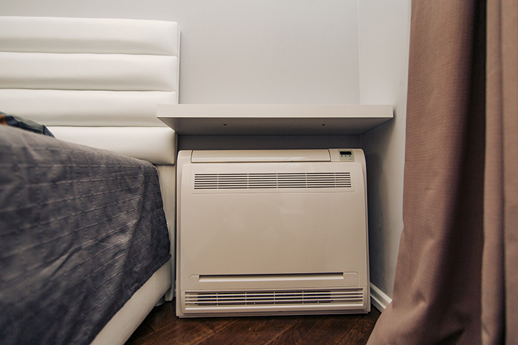 Picture of an air conditioning unit under a shelf 