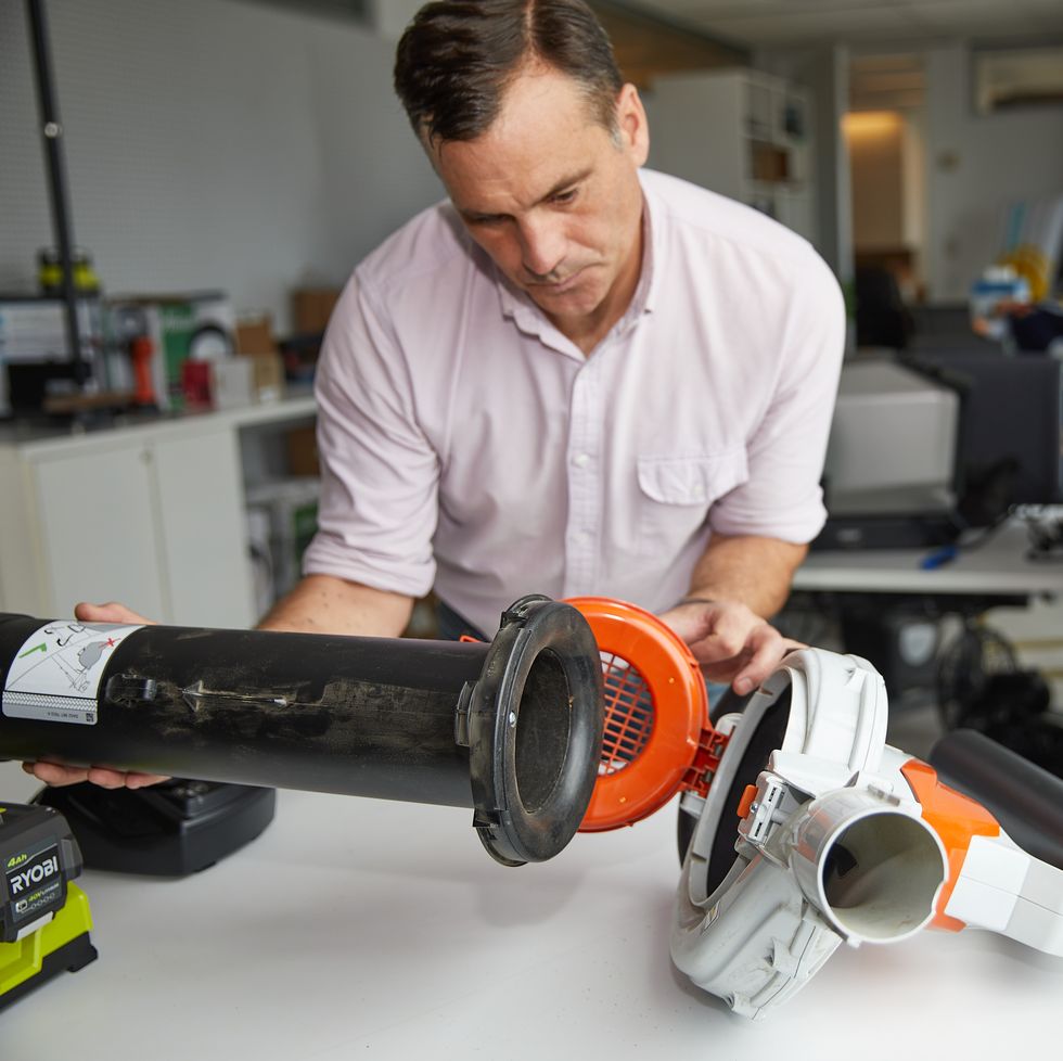 an expert at the good housekeeping institute assesses ease of assembly during lead vacuum testing