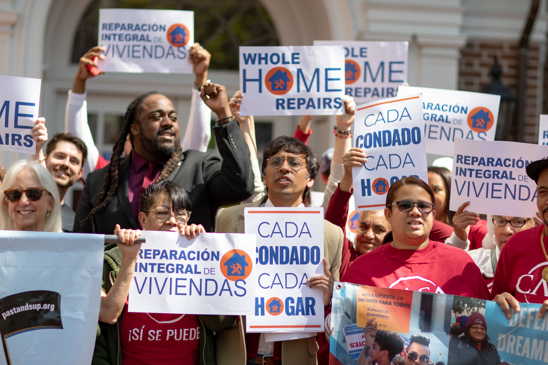  In April, state Sen. Nikil Saval, center, was joined by a crowd, including state Rep. Izzy Wade-Smith-El, left, supporting his Whole-Home Repairs progra