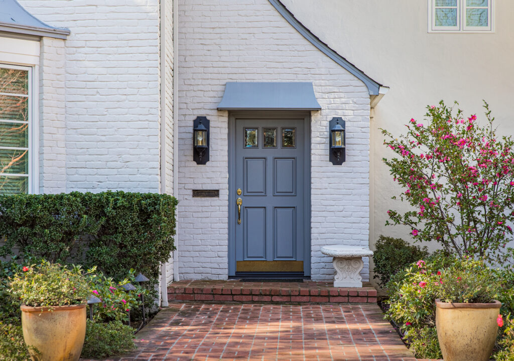 Picture of a front door painted in a grey blue colour 